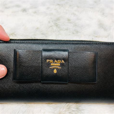 prada saffiano bow zip wallet|authentic prada wallet sale.